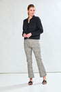 Woman in sand and black pants