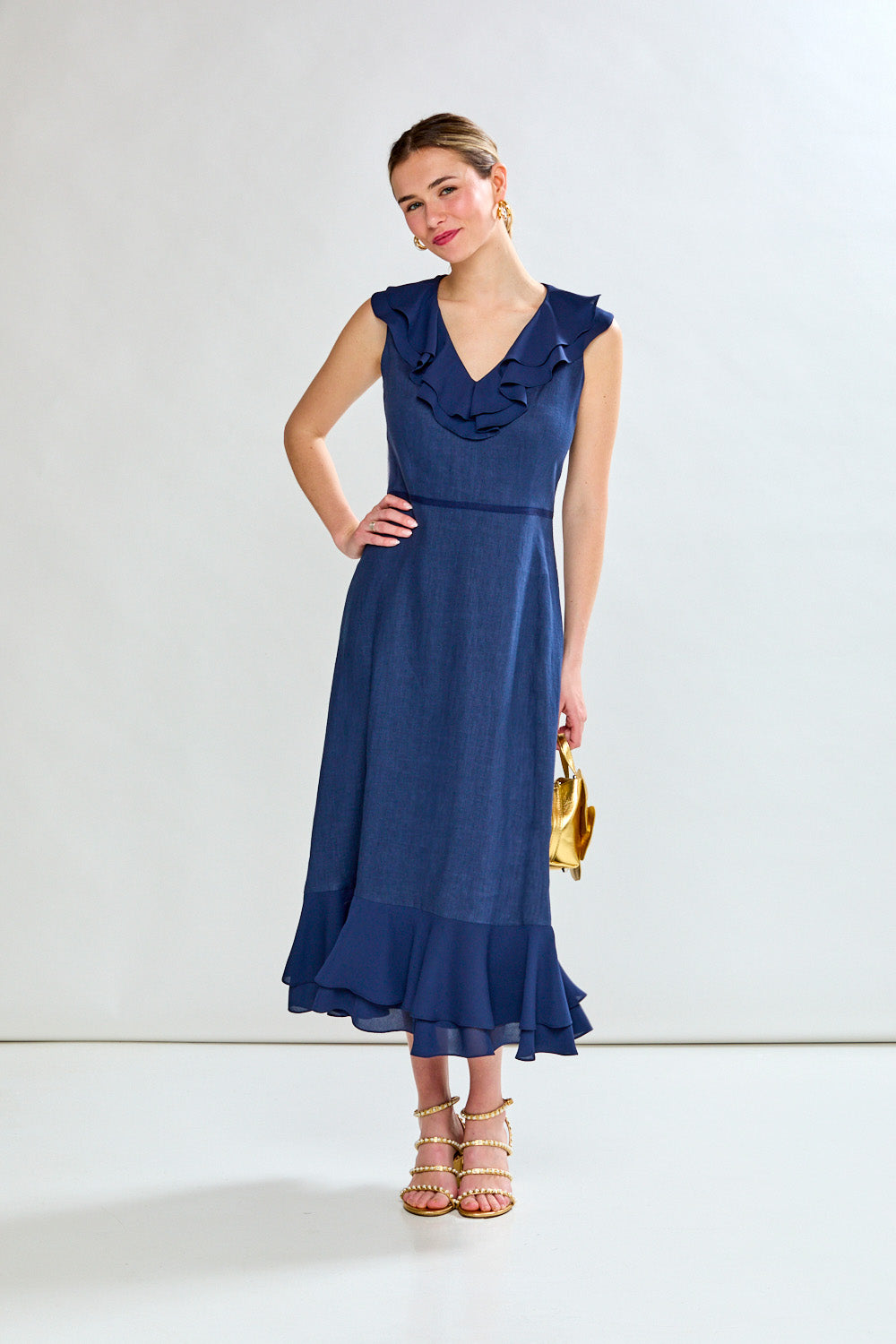 Woman in navy tea length dress