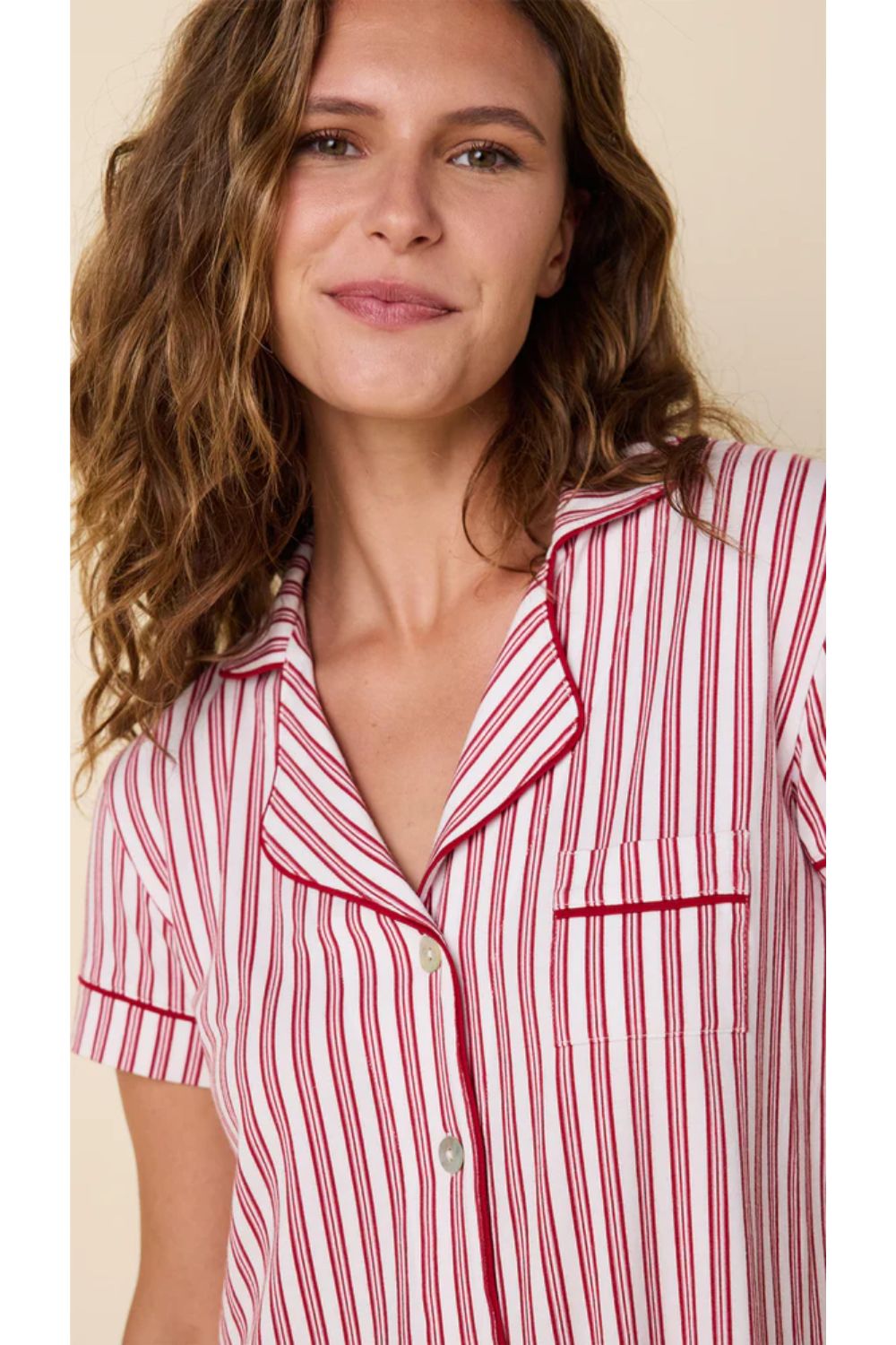 Woman in red and white striped pajamas