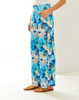 Woman in blue floral pants