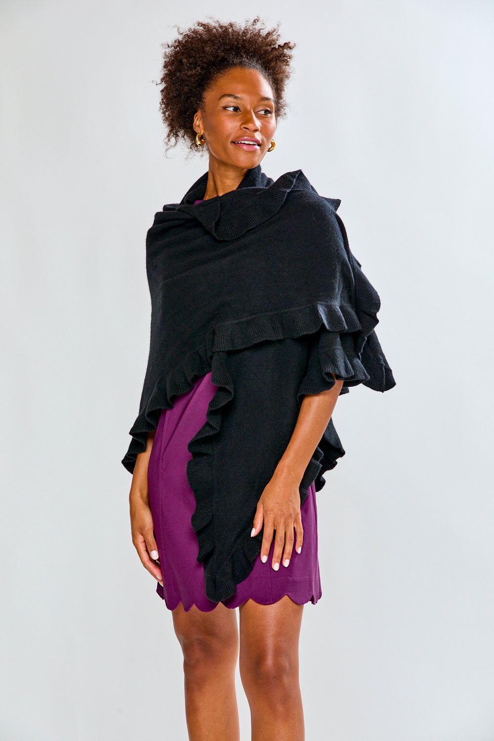 Woman wearing a black ruffle cashmere wrap