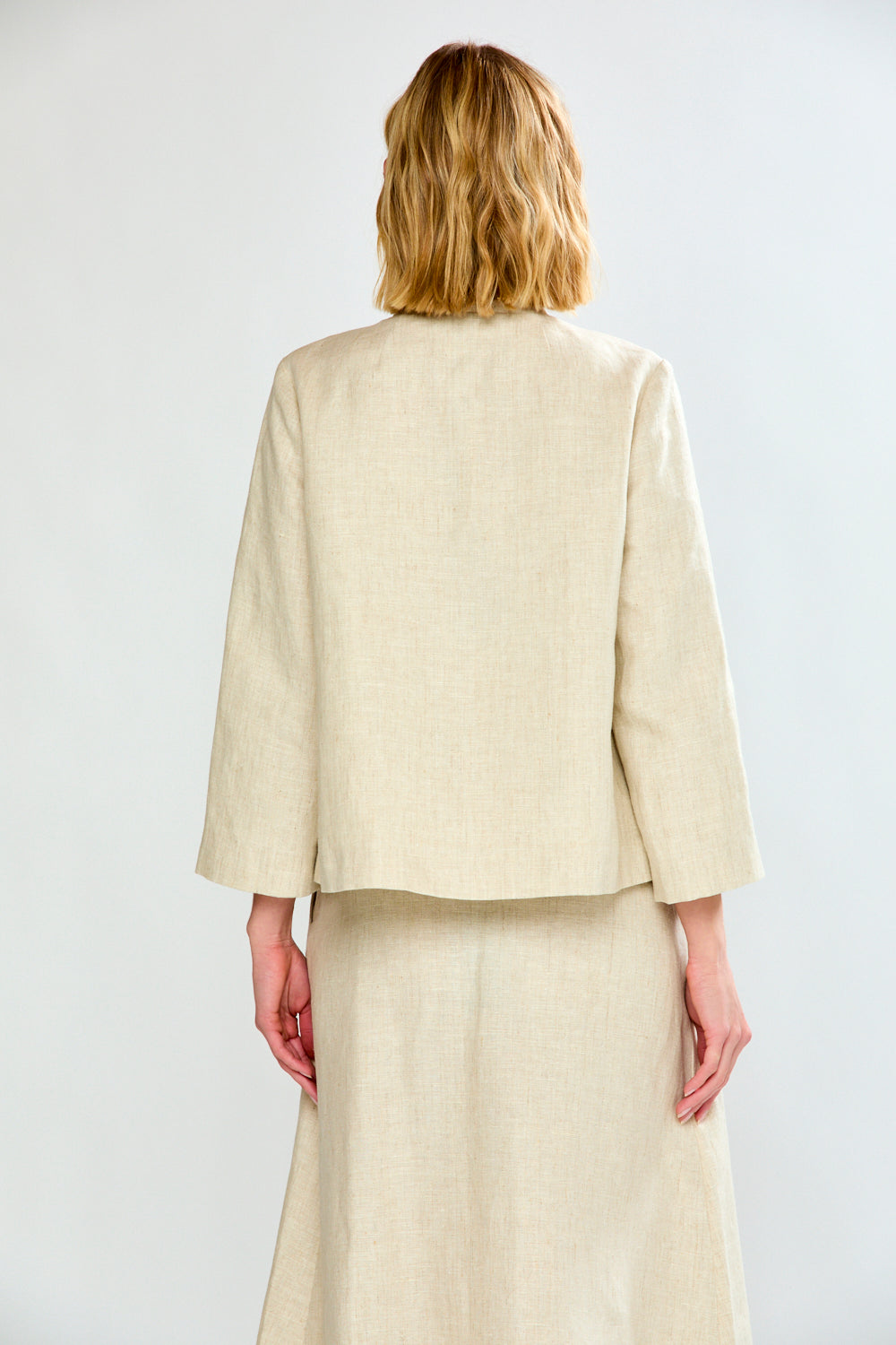 woman in light oatmeal coat