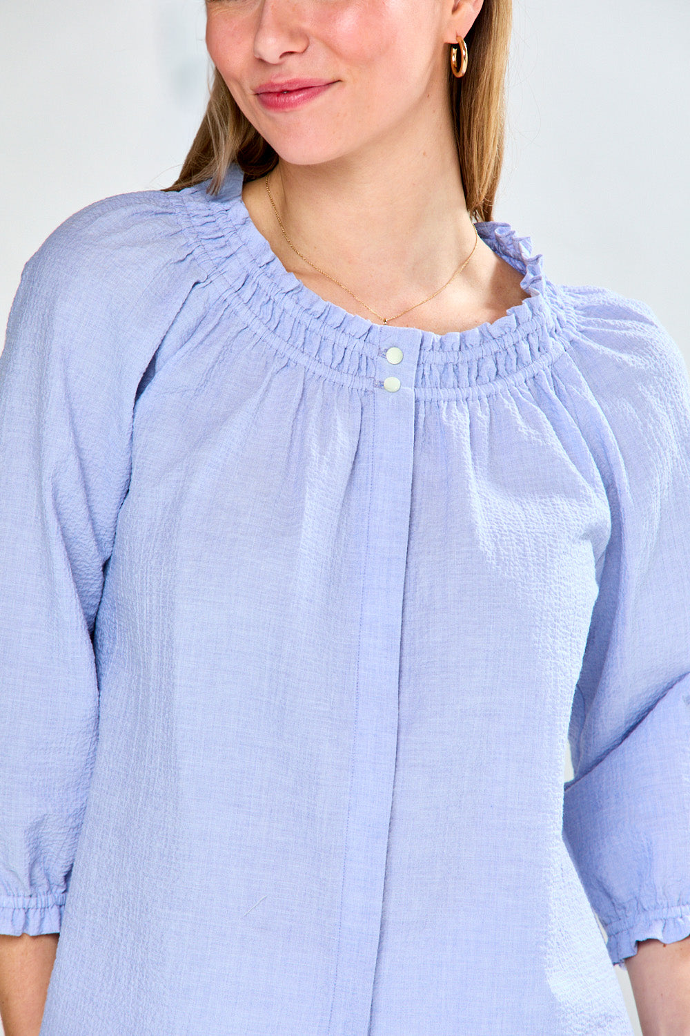 Woman in seersucker blouse