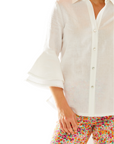 Woman in white button down blouse