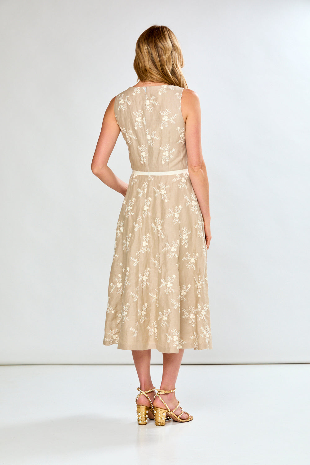 Woman in neutral floral dress