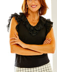 Woman in black sleeveless blouse