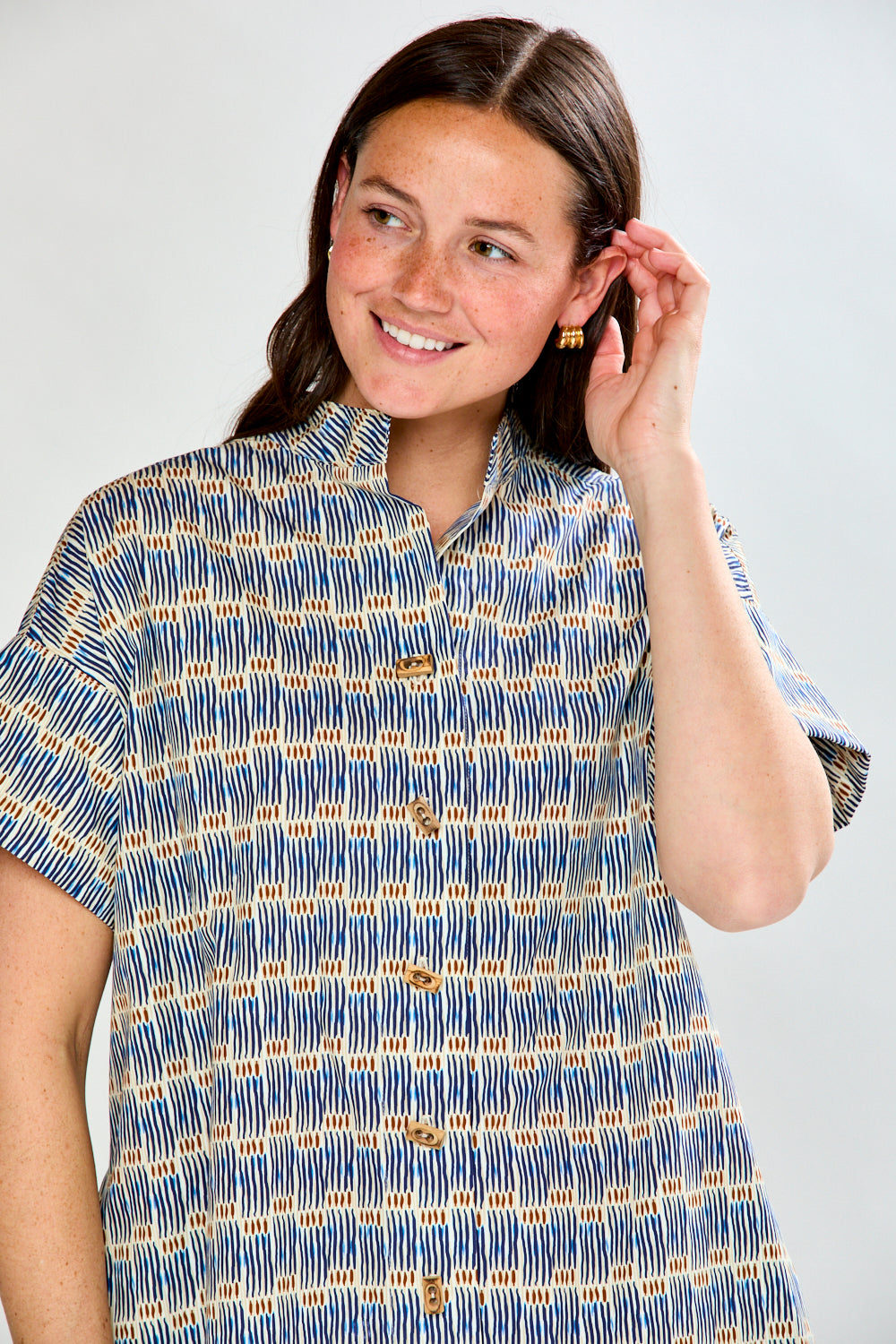 Woman in geo stripe dress