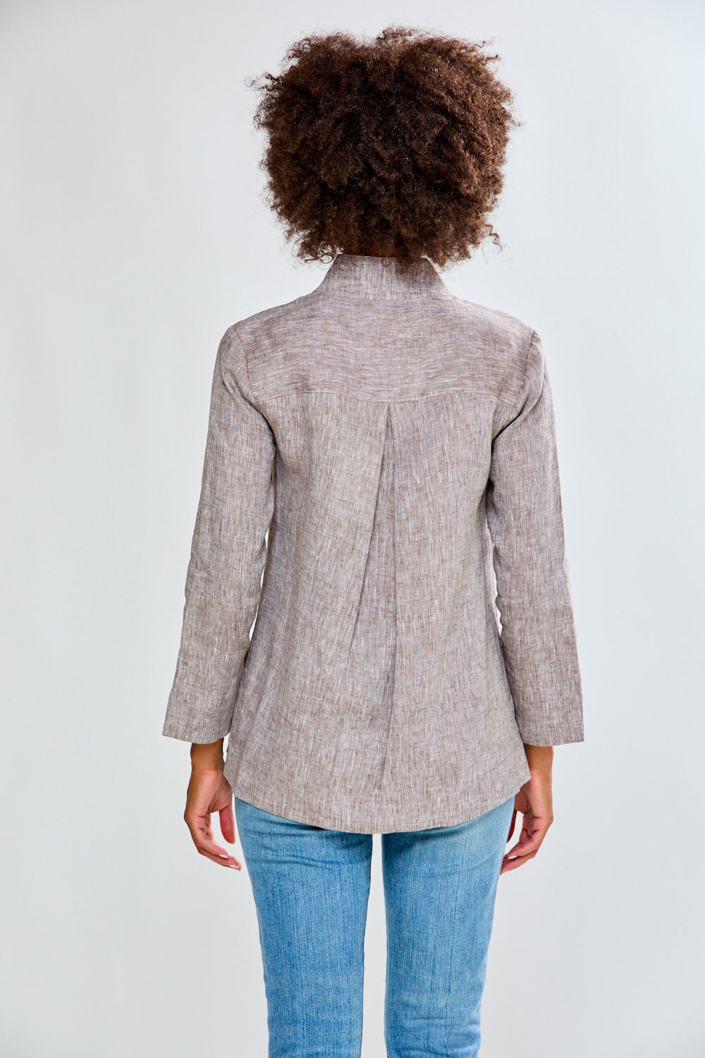 Woman in mocha linen top with jeans