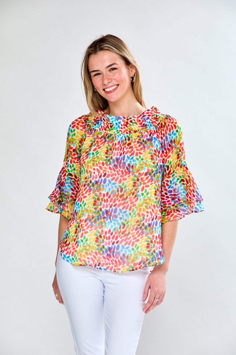 Woman in multi leaf print blouse