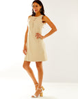 Woman in sand scalloped dress
