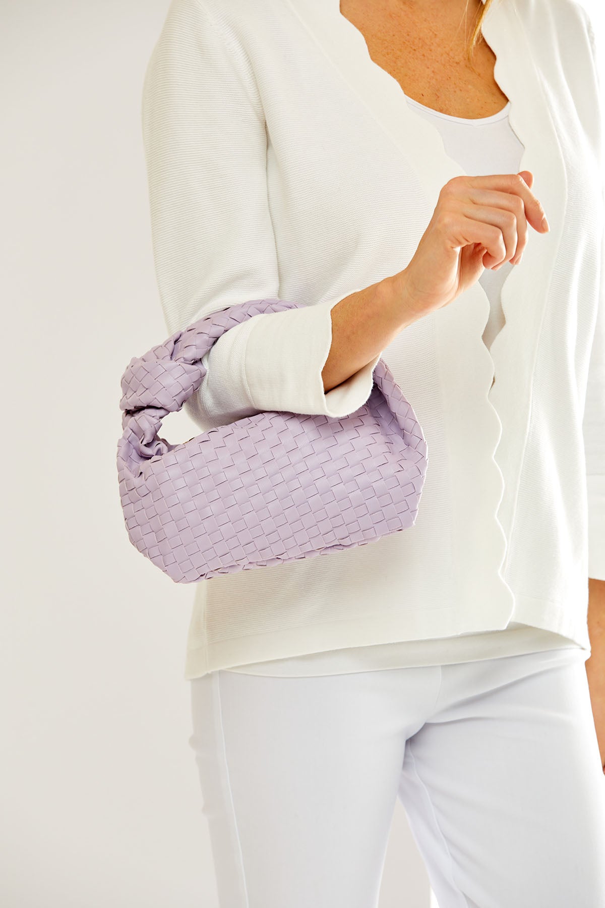 Woman holding a purple bag