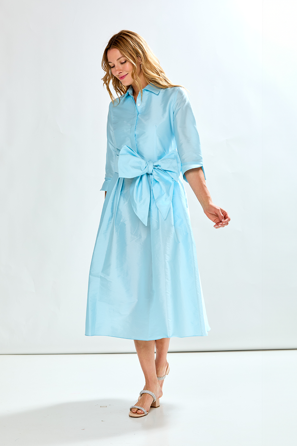 Woman in french blue taffeta dress