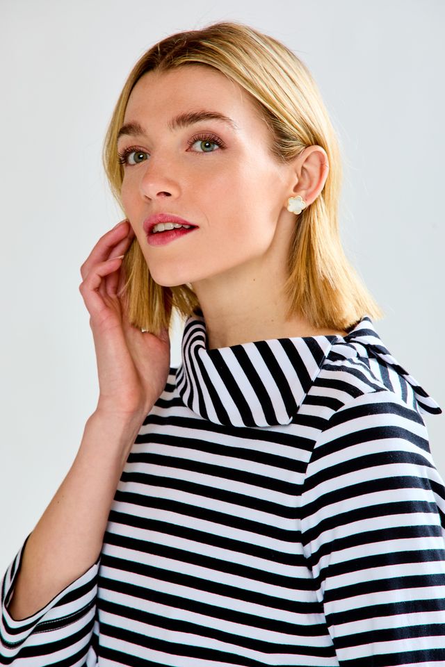 woman in flower earrings