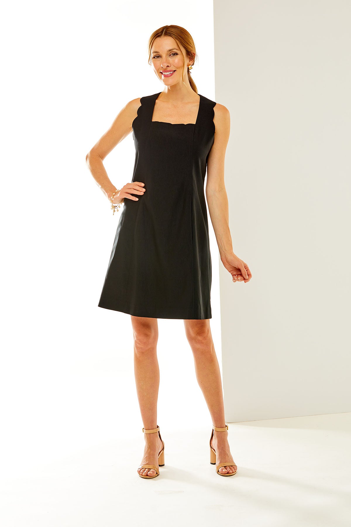 Woman in sleeveless black dress