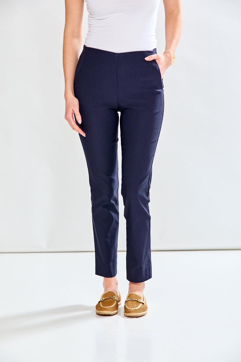 Woman in navy fitted pant