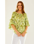 Woman in green paisley blouse