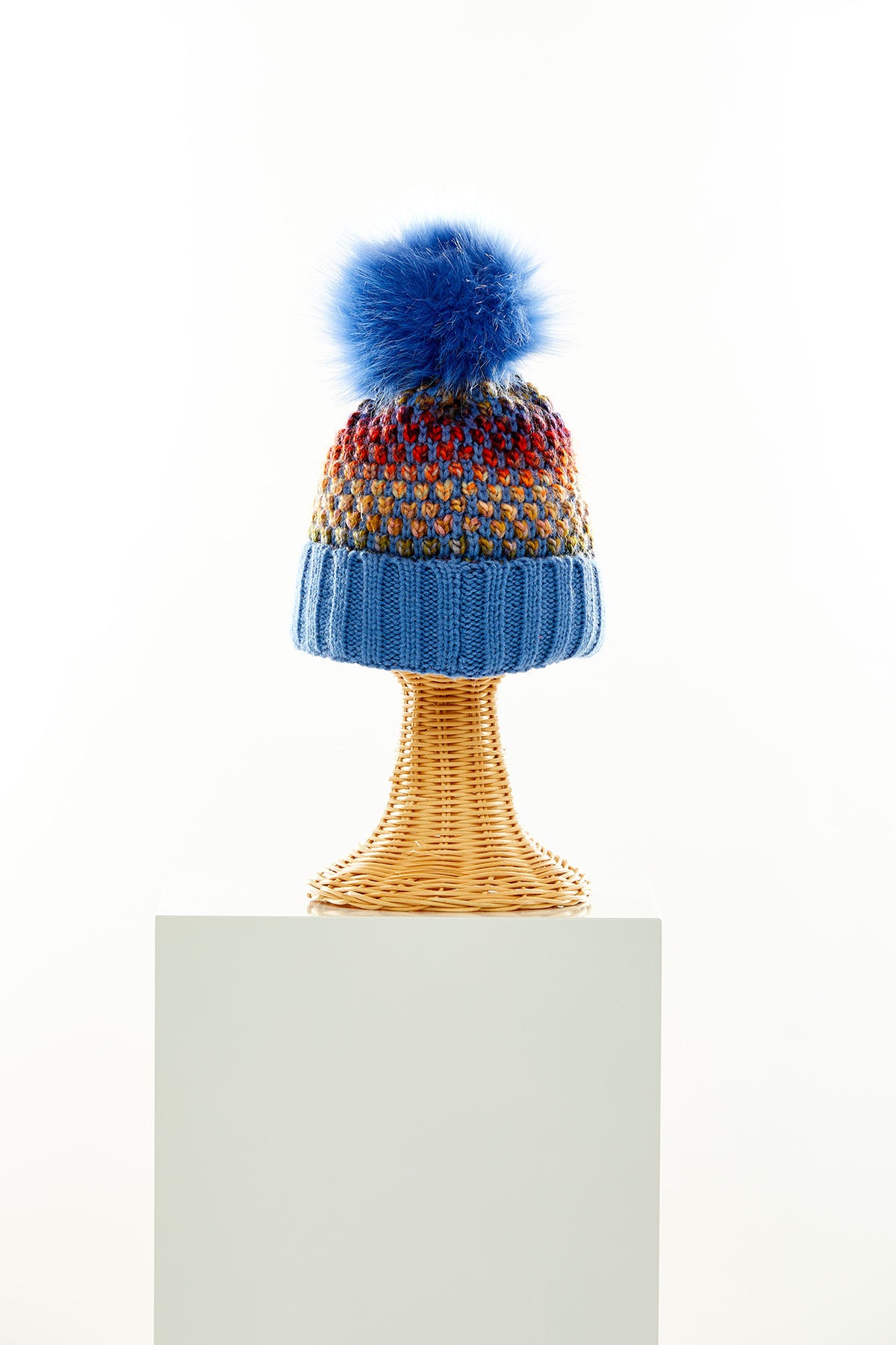 Blue/multi colored beanie with faux pom