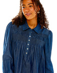 Woman in chambray shirt