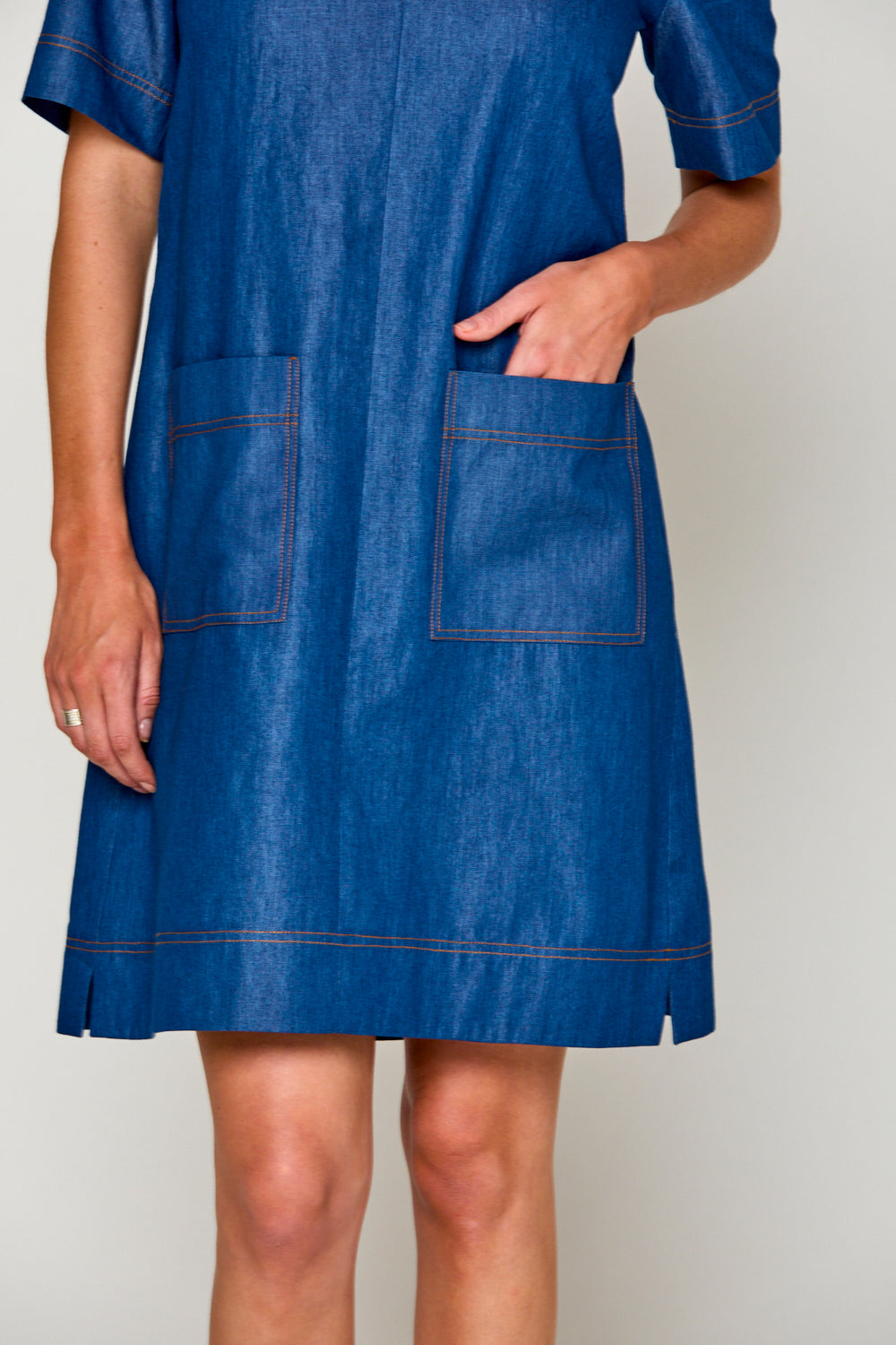 Woman in denim tencel dress