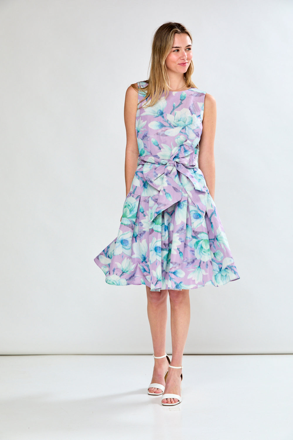 Woman in lilac floral dress