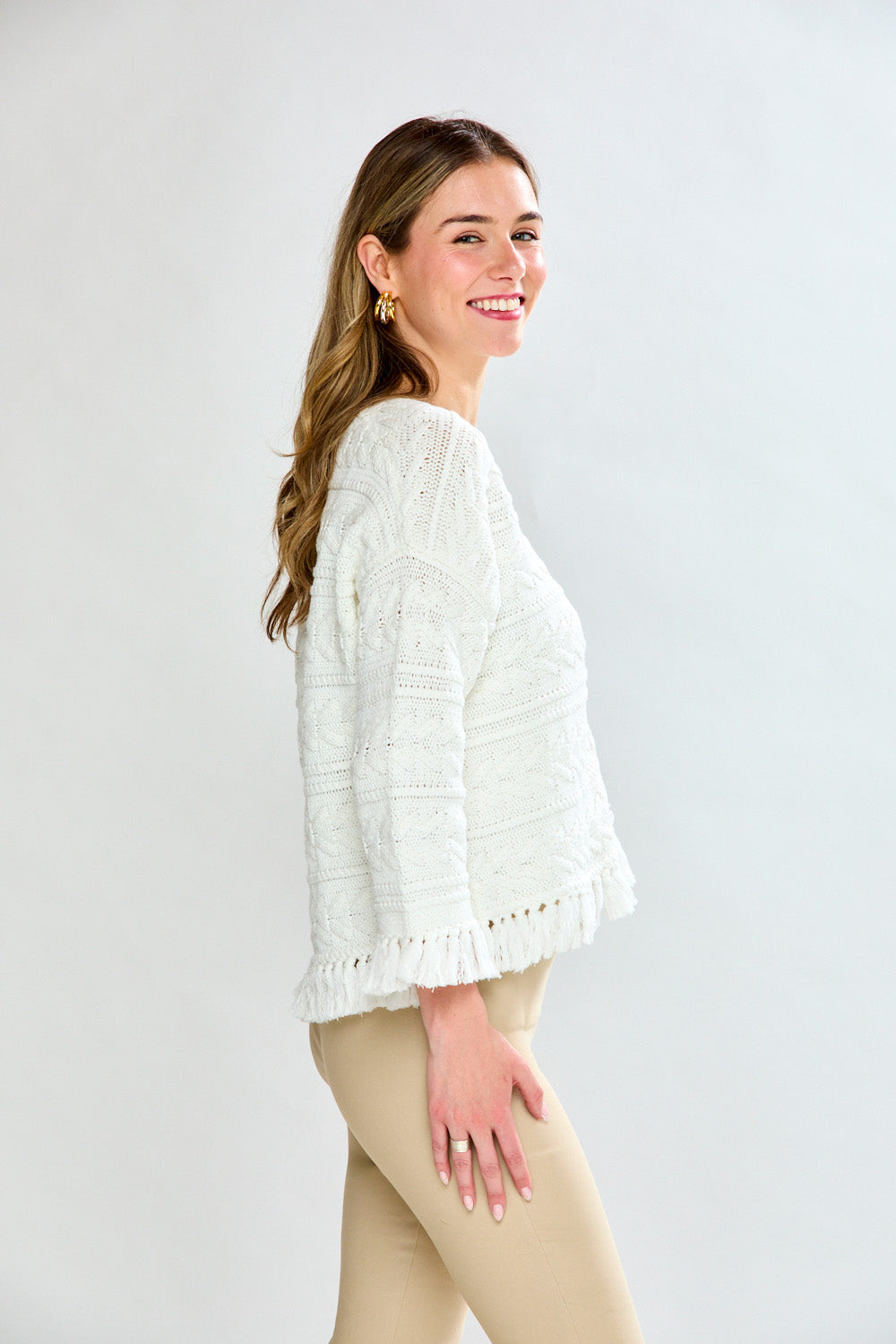 Woman in white fringe cardi