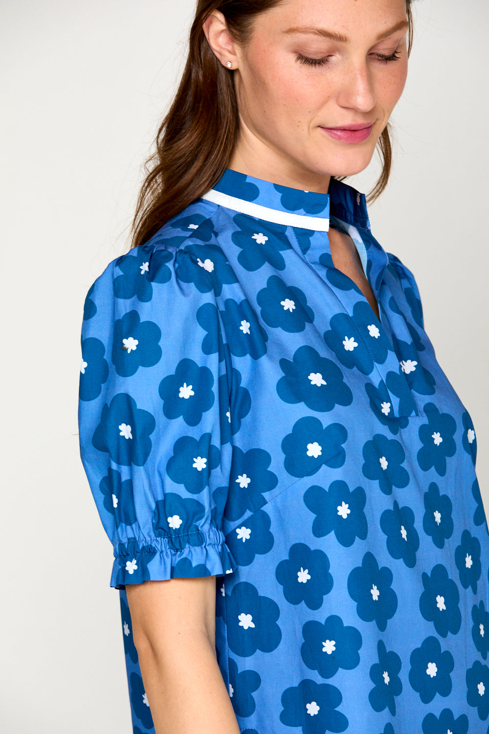 Woman in blue daisy dress