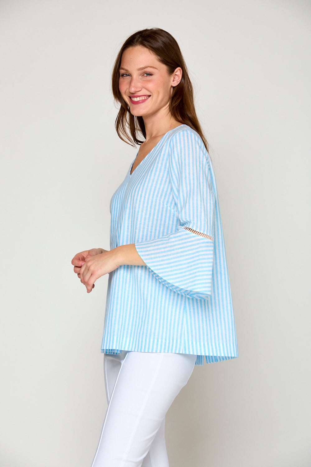 Woman in blue and white striped blouse