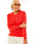 Woman in coral v neck pullover