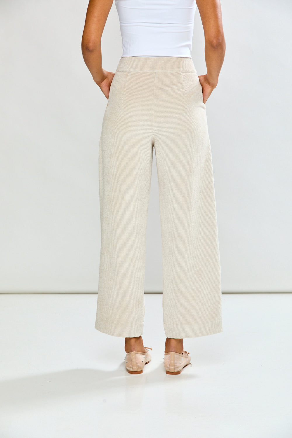 Woman in oyster corduroy pant