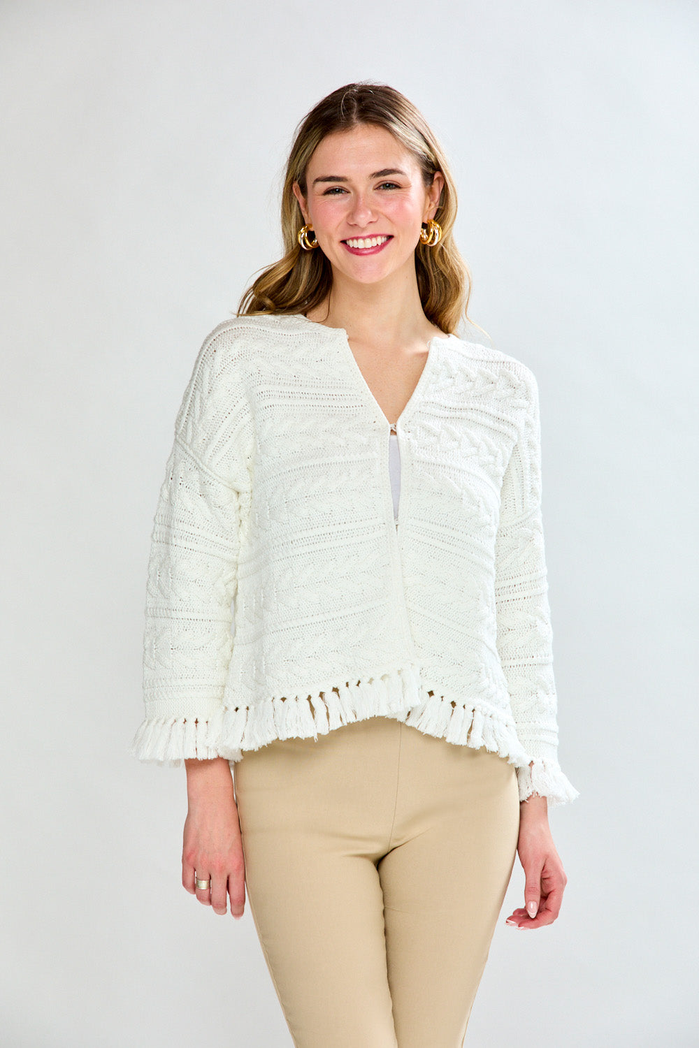 Woman in white fringe cardi