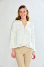 Woman in white fringe cardi