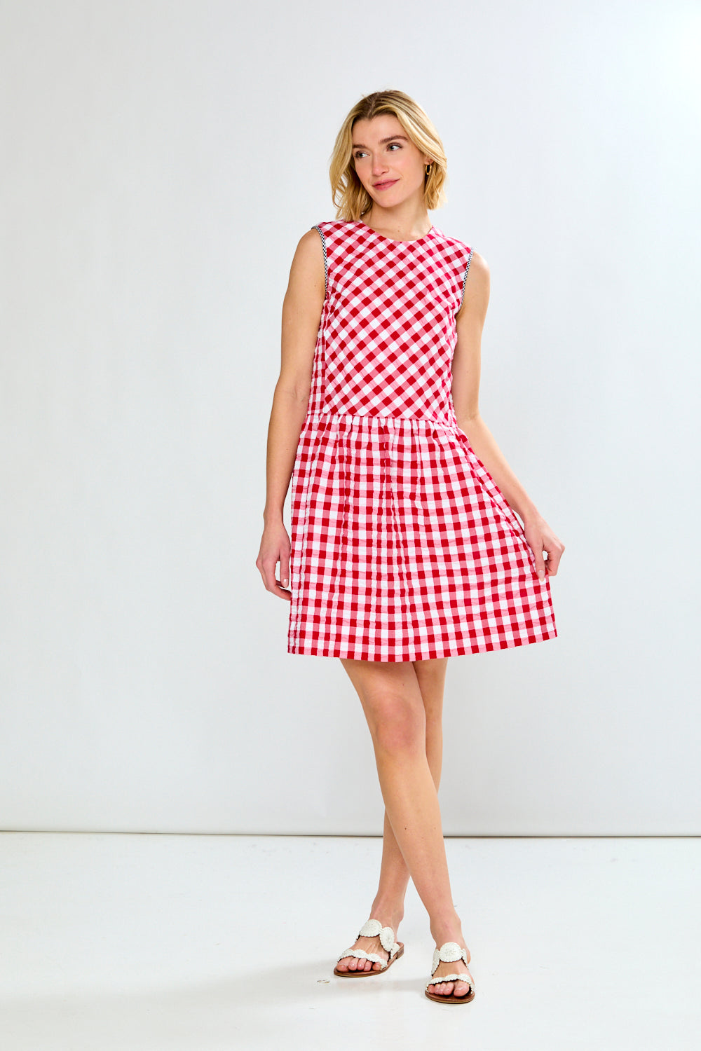 woman in red check dress
