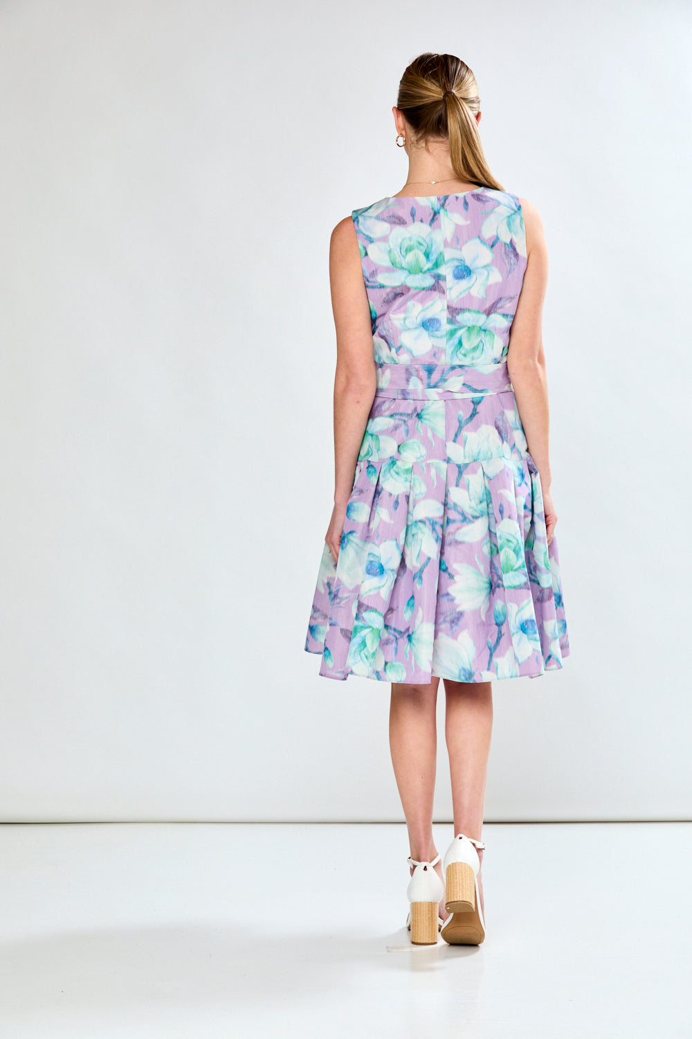 Woman in lilac floral dress