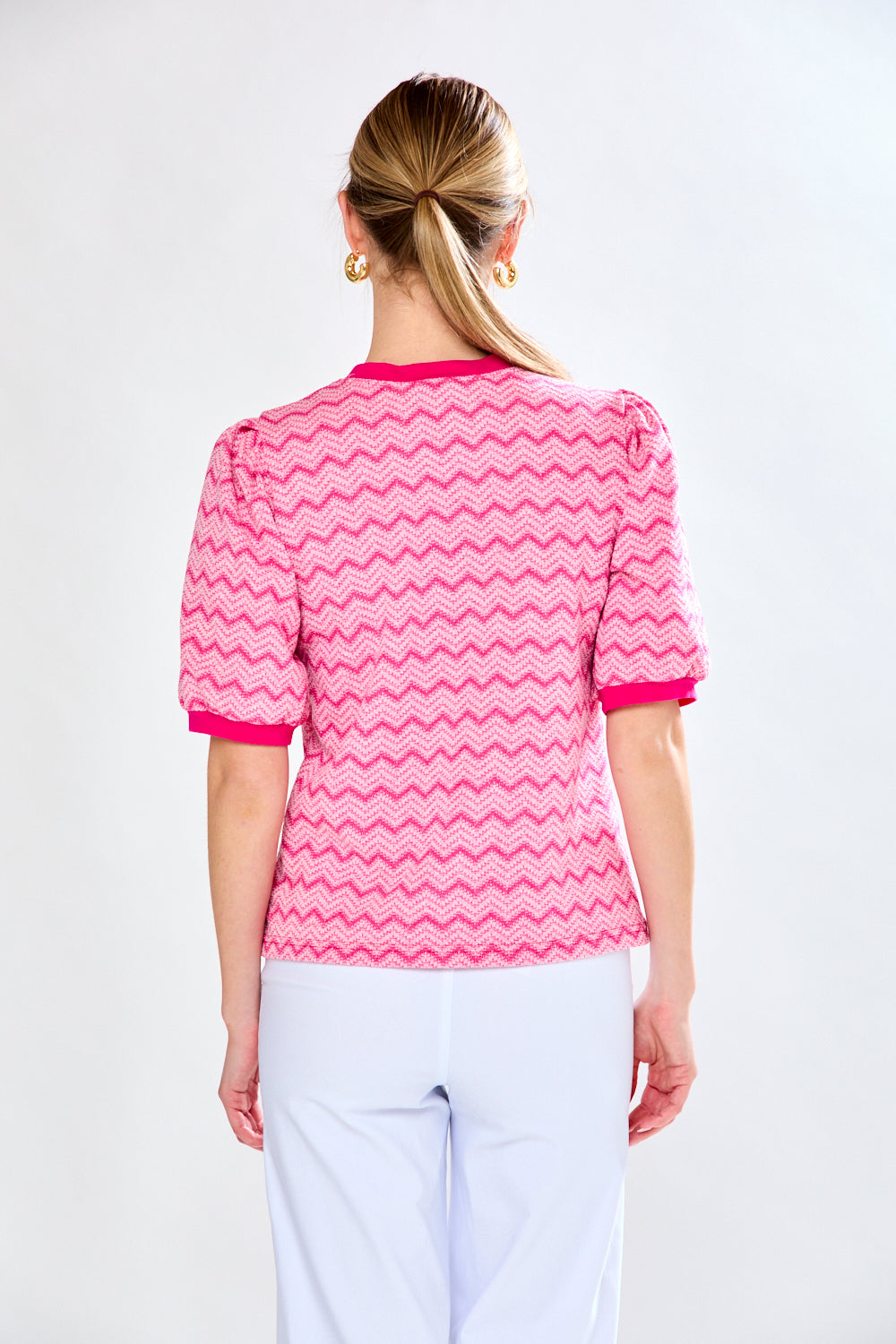 Woman in pink chevron top