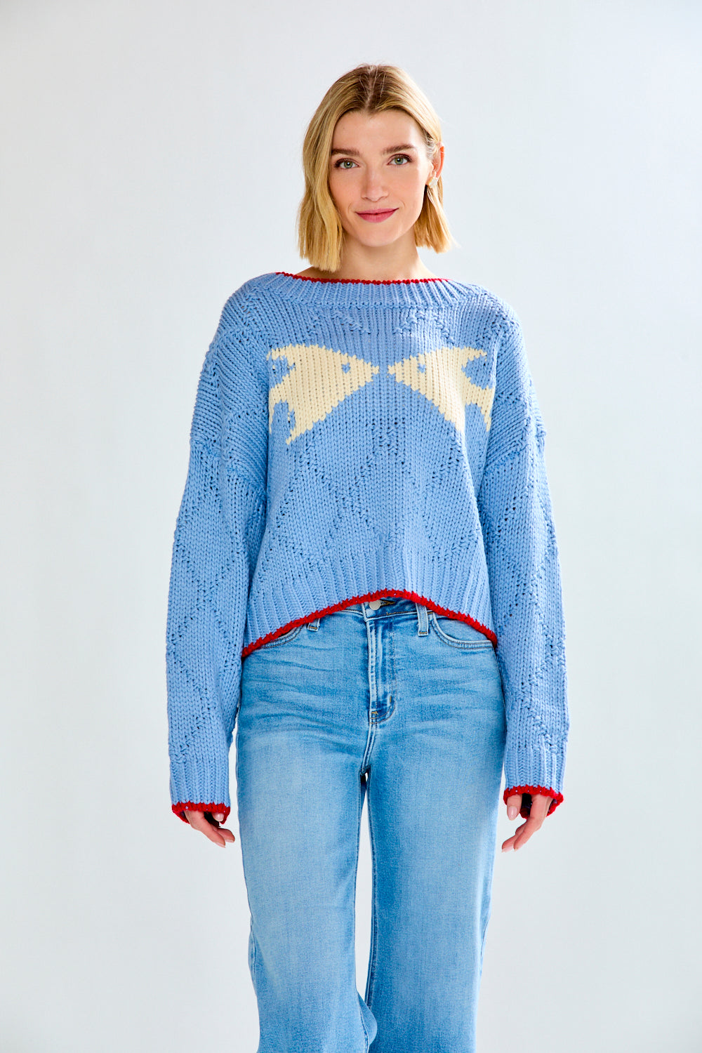 Woman with blue fish sweater on