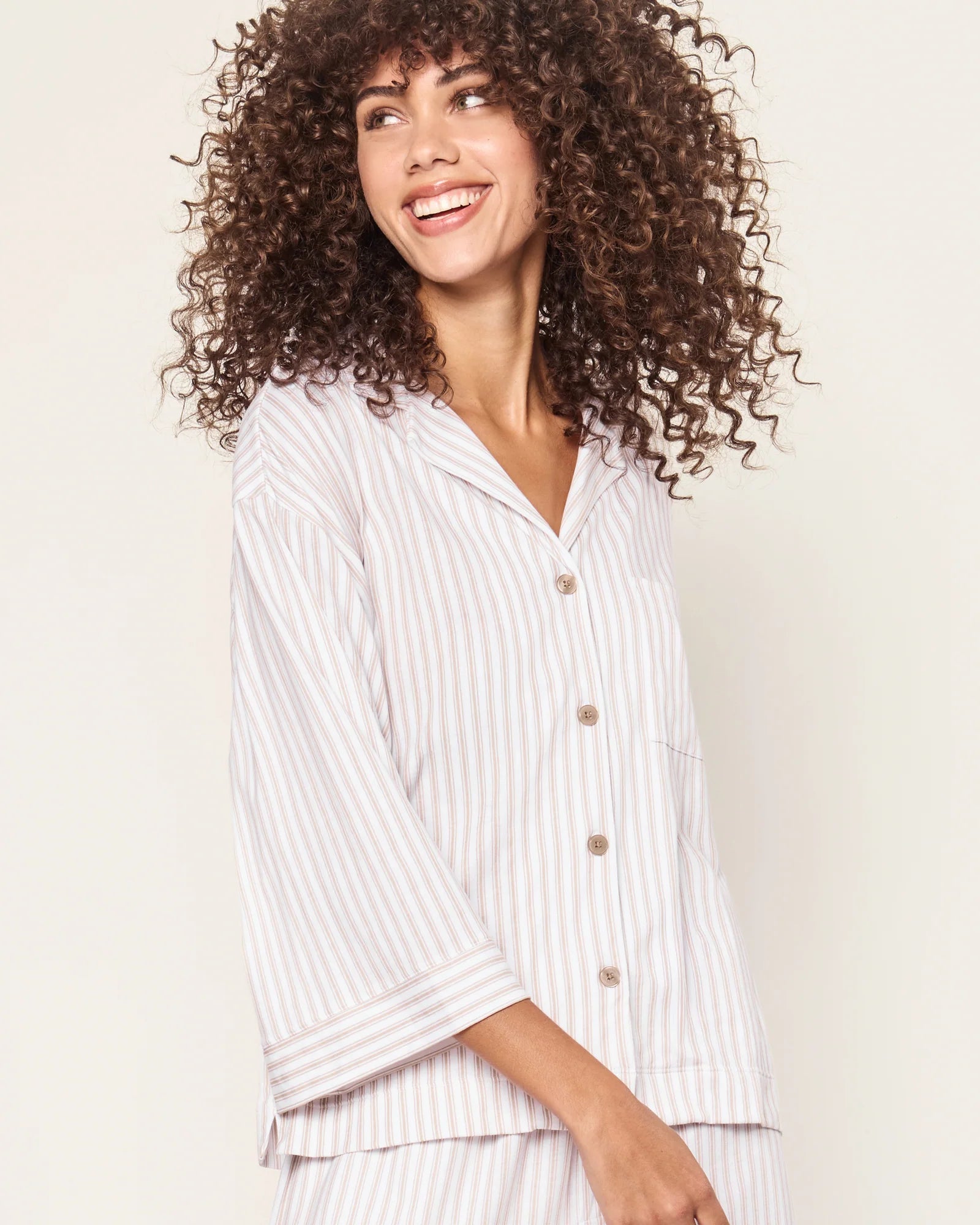 Woman in beige pajamas