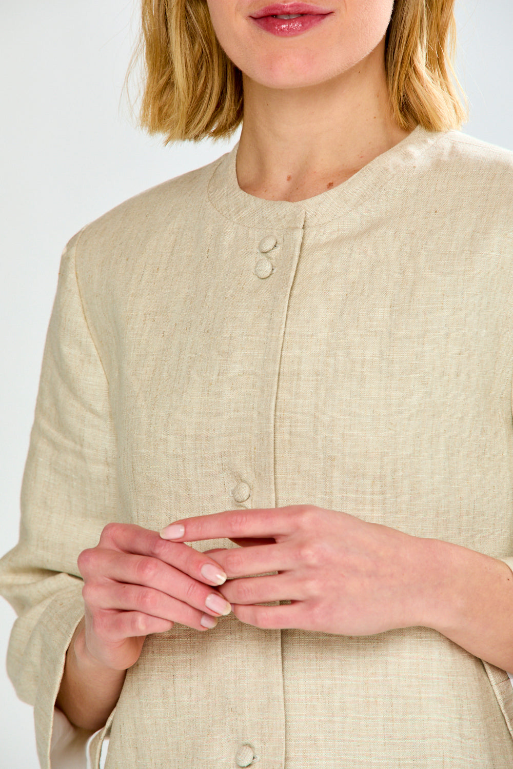 woman in light oatmeal coat