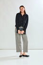 Woman in black sweater jacket