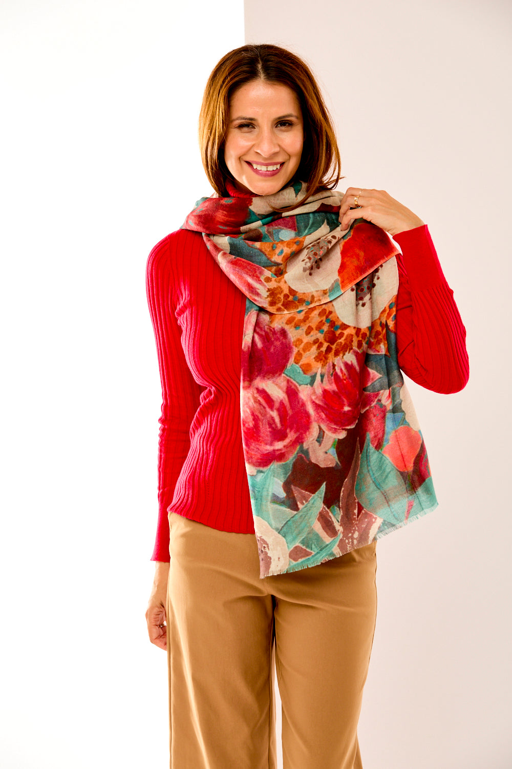 Woman in floral teal and orange scarf