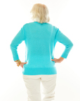 Woman in aqua cashmere pullover