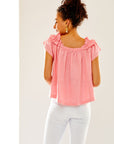 Woman in cotton candy ruffled top