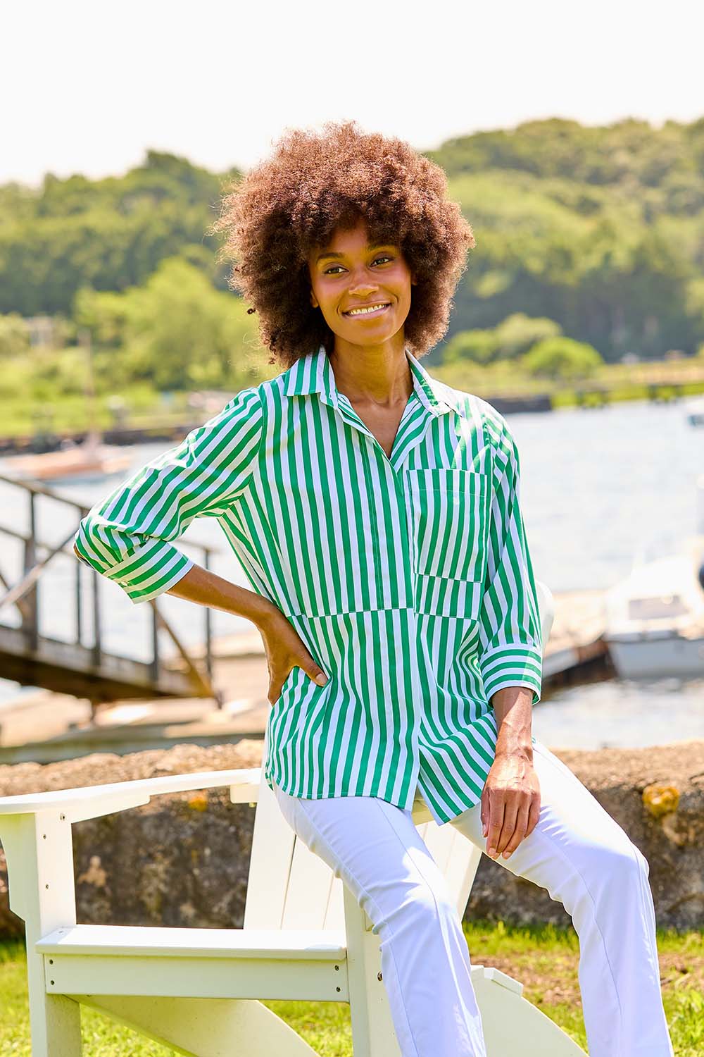 Woman in green and white stripe blouse