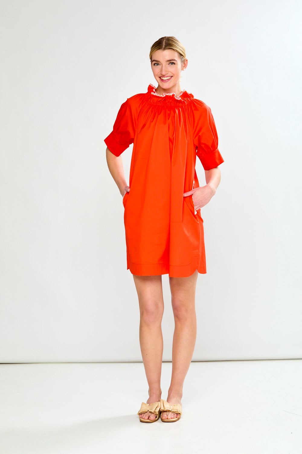 Woman wearing The Wren Dress in Guava