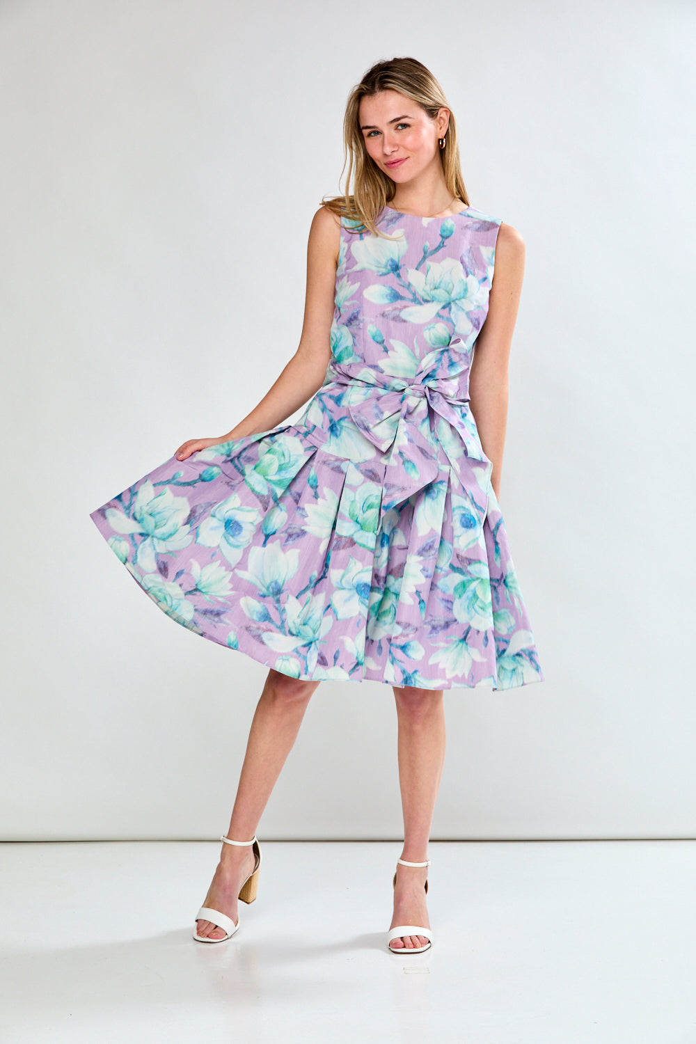 Woman in lilac floral dress