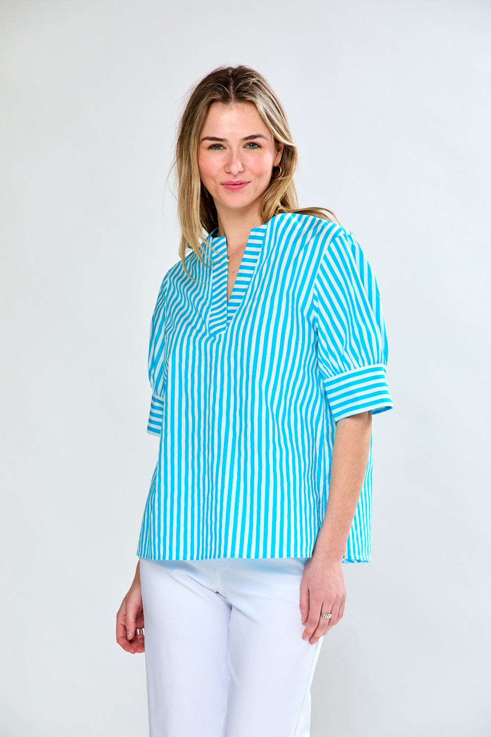 Woman in aqua stripe top