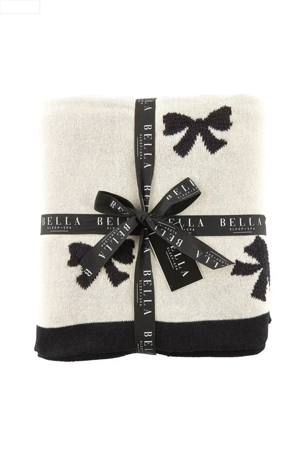 Folded blanket with black bow patterns on a white background