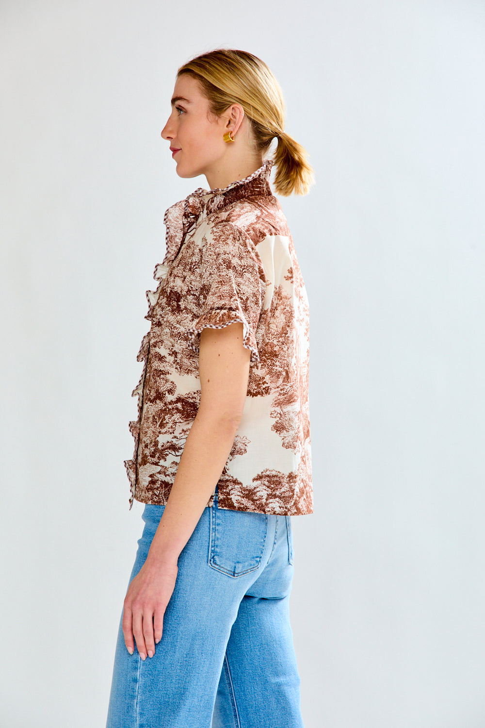 woman in brown toile top