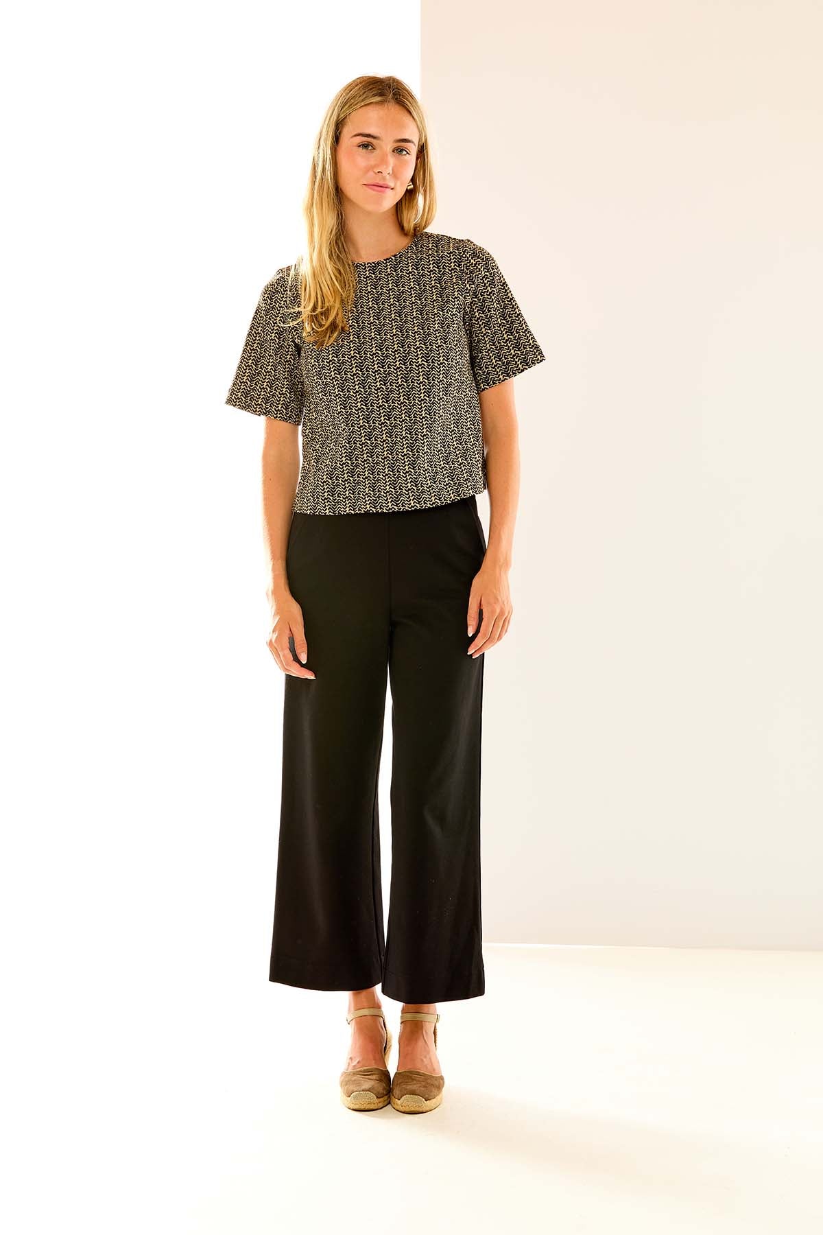 Woman in black wide leg pant