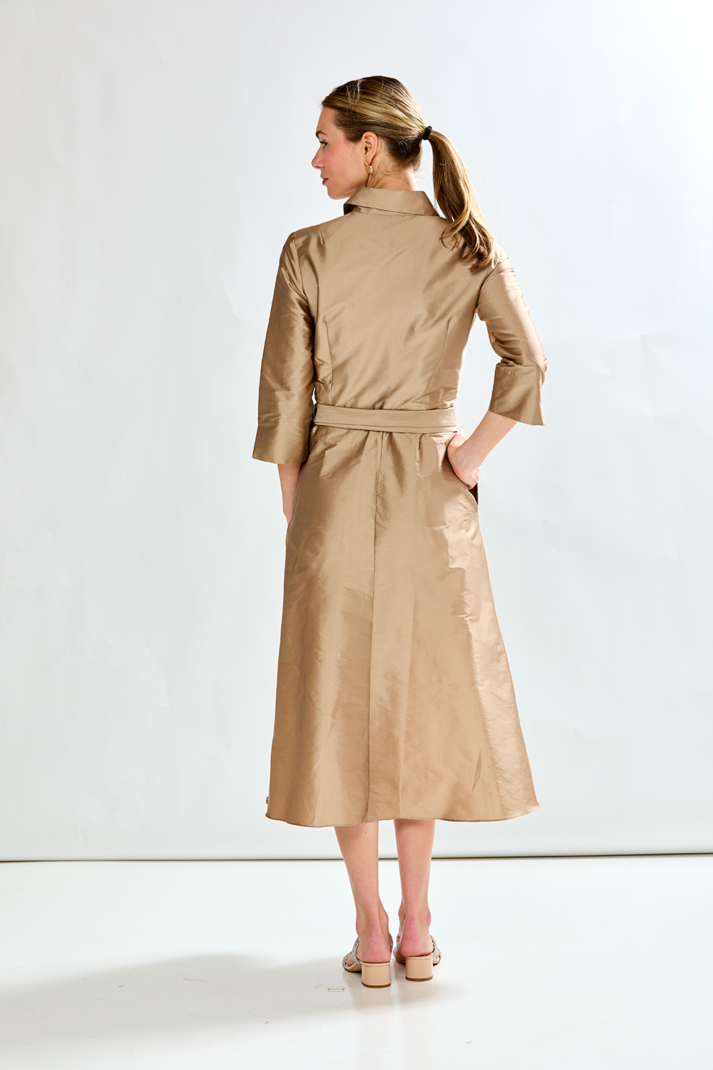Woman in mocha taffeta dress