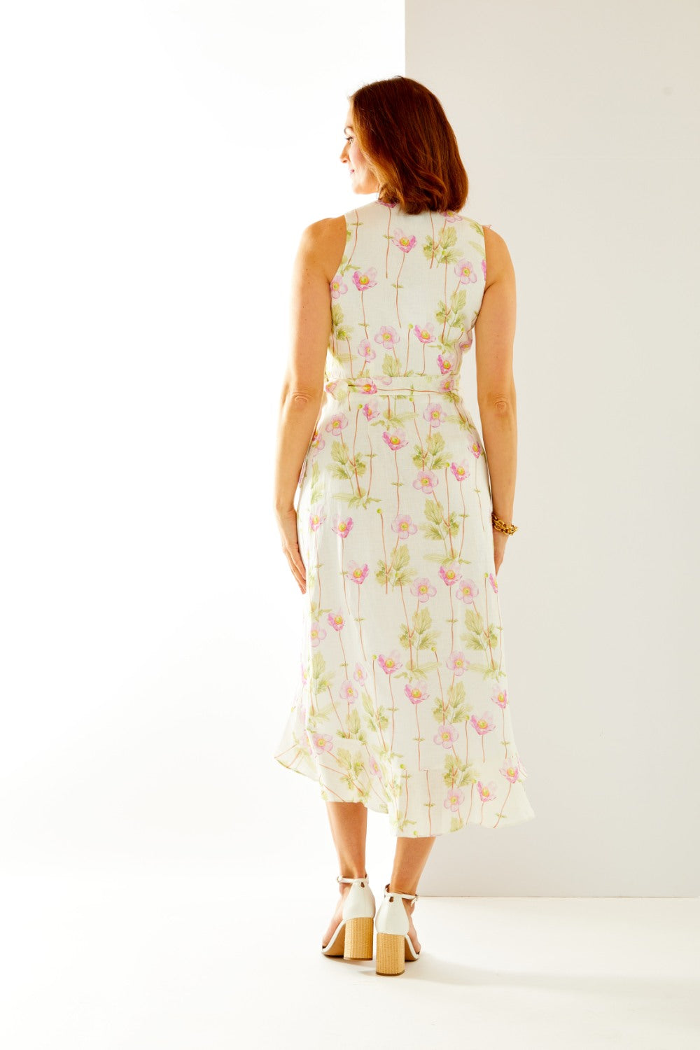 Woman in floral wrap dress